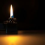 Neon blue light sparks on dark background focus